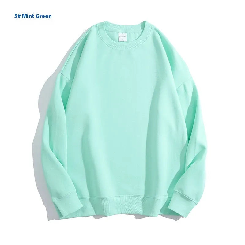 Cotton off shoulder pullover sweater in a loose fit, shown in a solid colour with long sleeves.