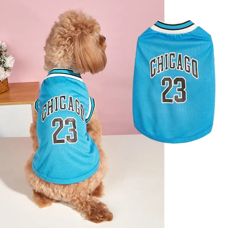 Dog wearing a black mesh polyester basketball vest with number 23 print, side view