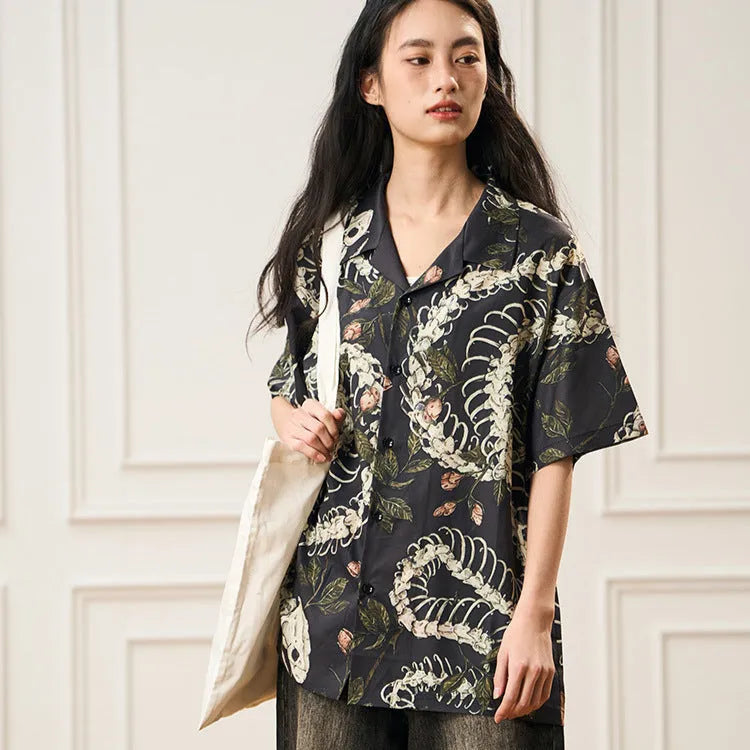 Short sleeve Cuban collar shirt with a printed snake bone and floral pattern in a loose fit.