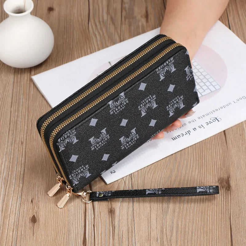 Long black PU leather wallet clutch with retro styling, open to show mobile phone compartment and coin purse sections