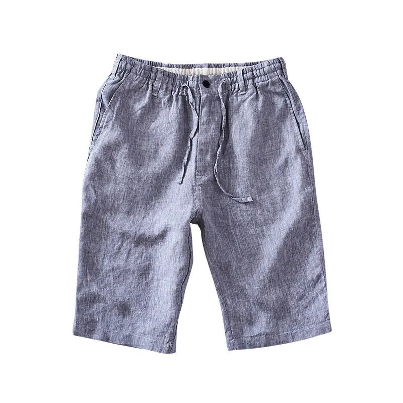 Men's loose-fitting linen capri trousers in a straight-leg style on a neutral background.