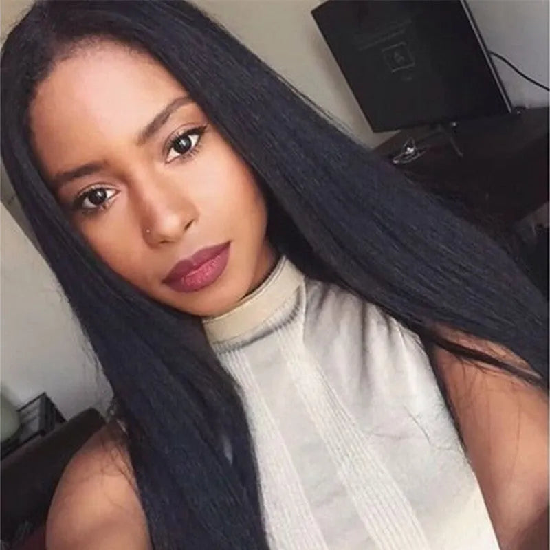 Long straight black synthetic wig with centre-parted bangs on display