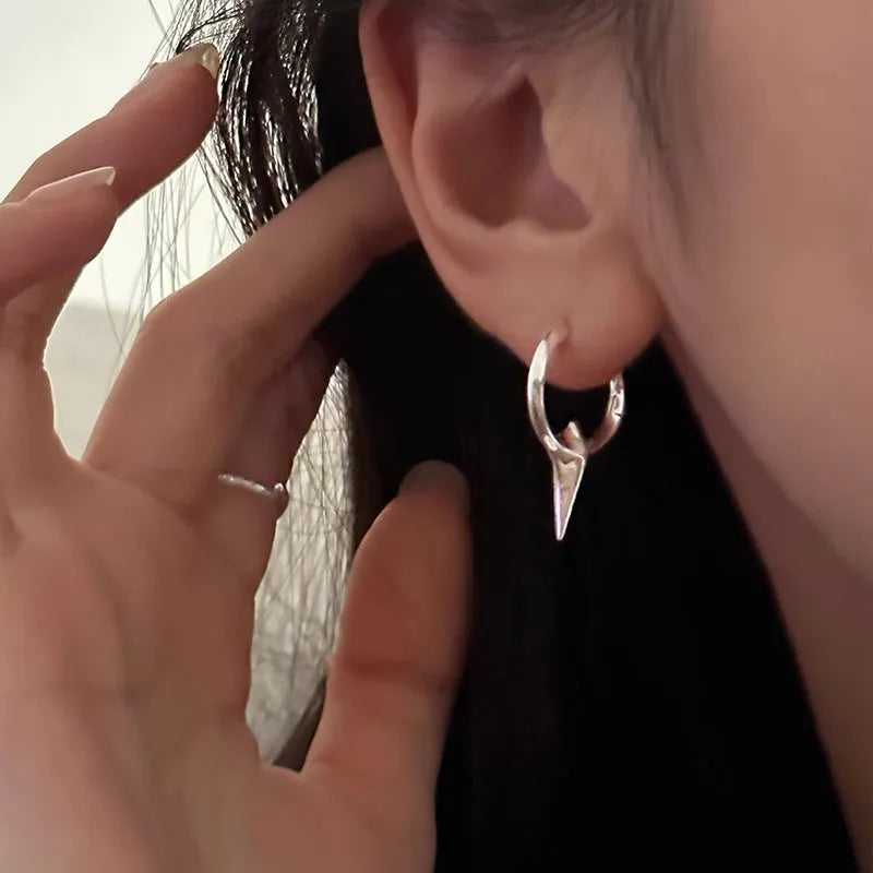 Geometric star stud earrings for women with white gold plated finish on copper.