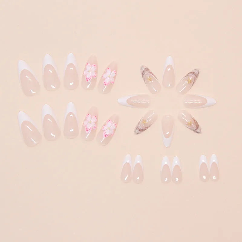 French style fake nails with simple flower pattern in a plastic kit including glue.