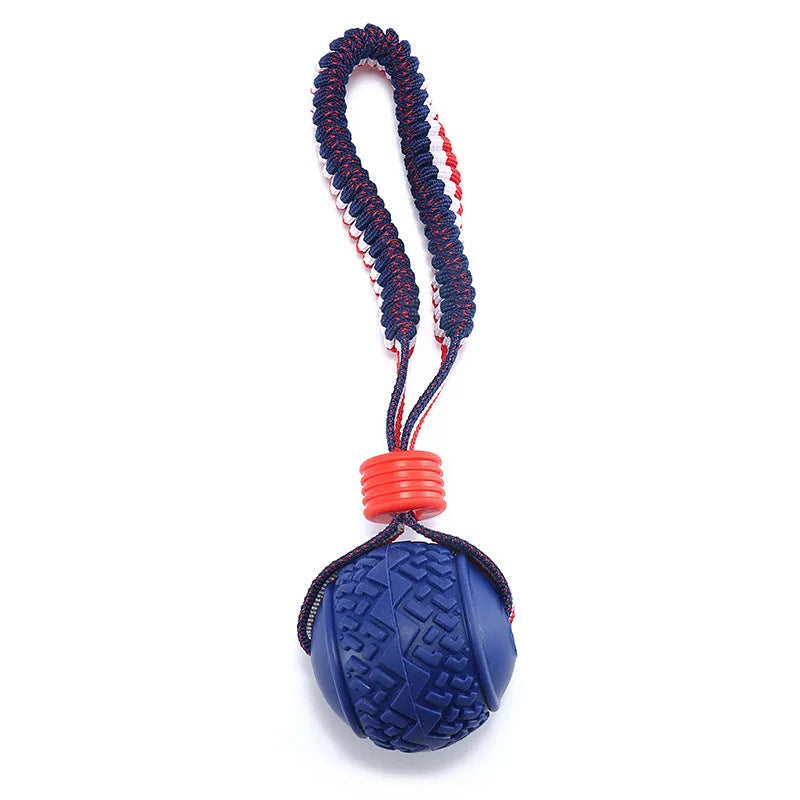 Blue dog ball with rope toy showing textured surface and cotton rope attachment