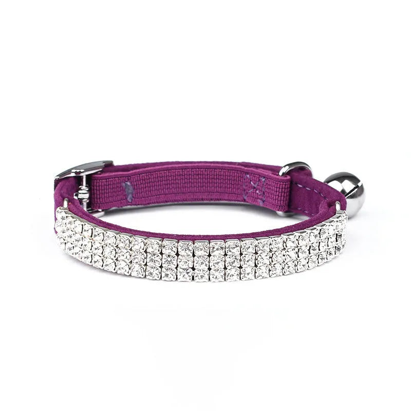 Adjustable red velvet cat collar with rhinestone decoration on a white background