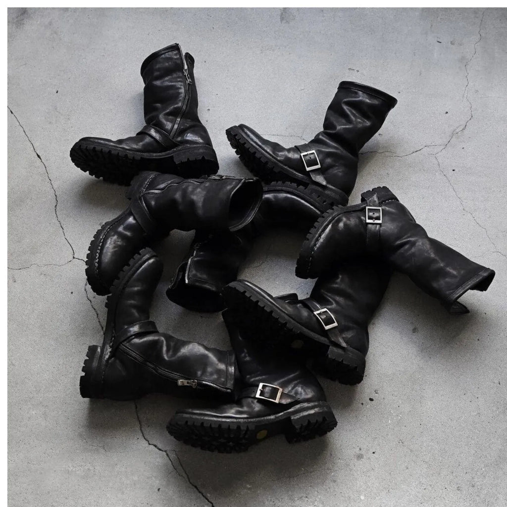 Men's dark retro Martin ankle boots with side zipper and round toe in black.