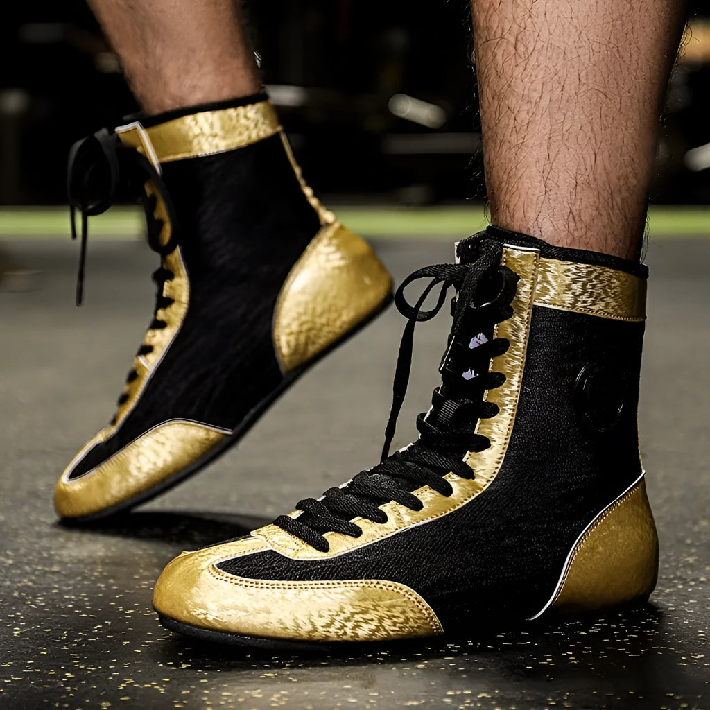 Black gold mesh professional boxing shoes with white leather accents and rubber sole