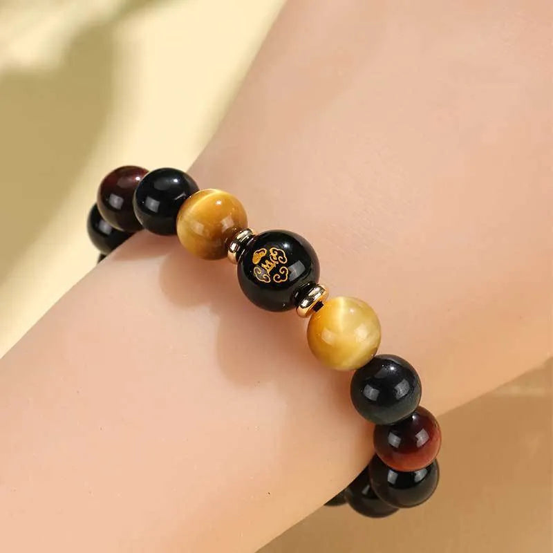 Handmade black agate beaded bracelet with Buddhist carving and tiger eye gemstones