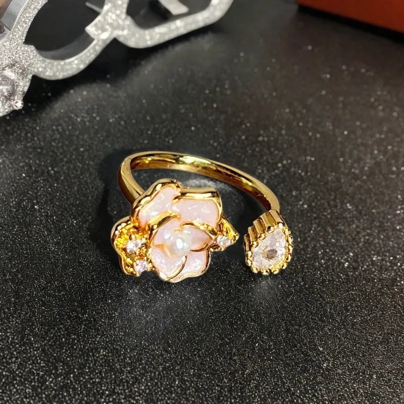 Adjustable copper ring with vintage gourd, flower, and bow design, inlaid with zircon stones.