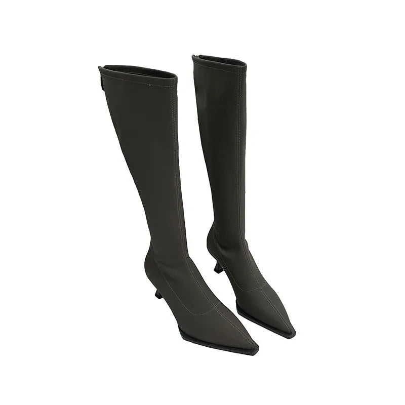 Women's black below the knee boots with pointed toe and stiletto heel, back zipper closure visible