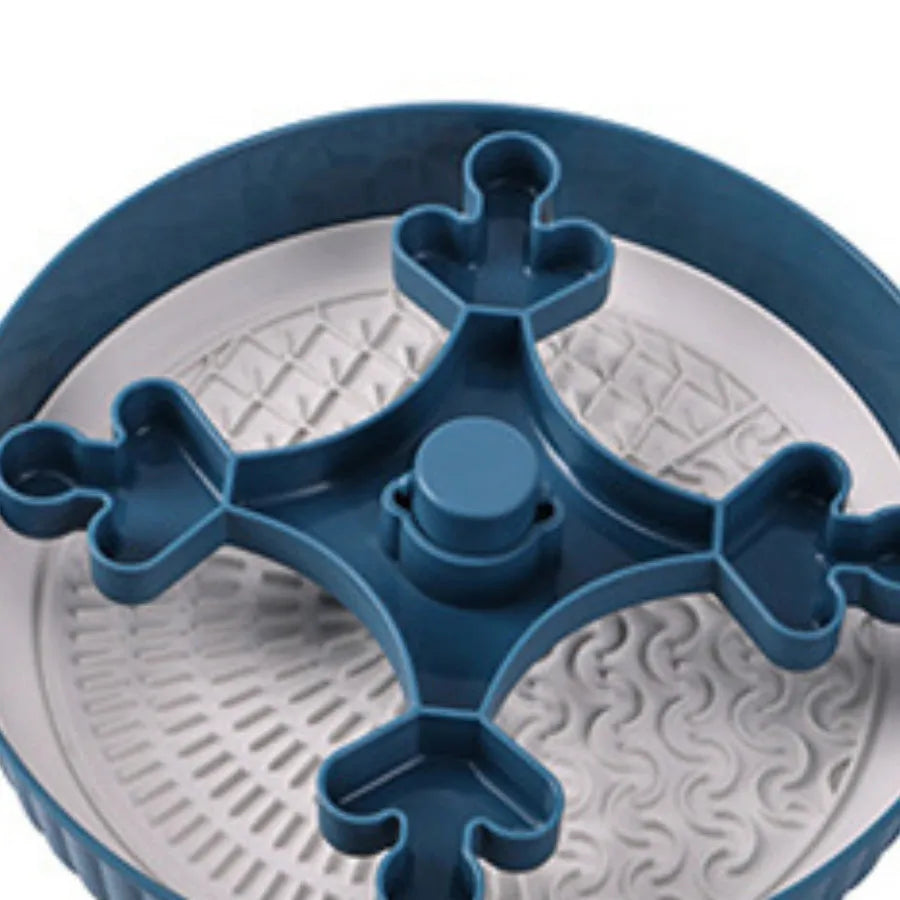 Slow feeder dog bowl with rotating game board and textured silicone licking mat insert.