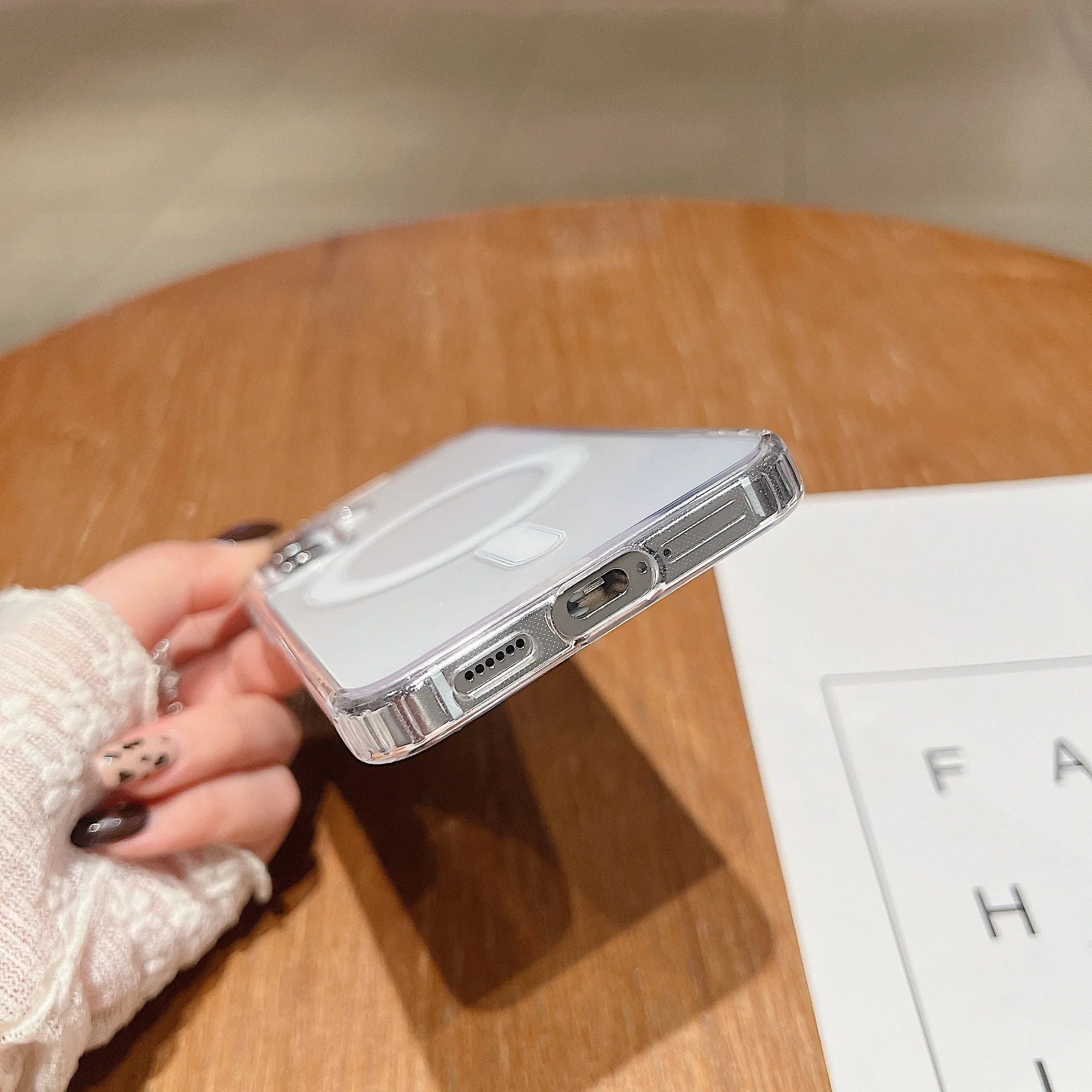 Clear magnetic silicone phone case on a Samsung smartphone showing transparent design and all-inclusive coverage.