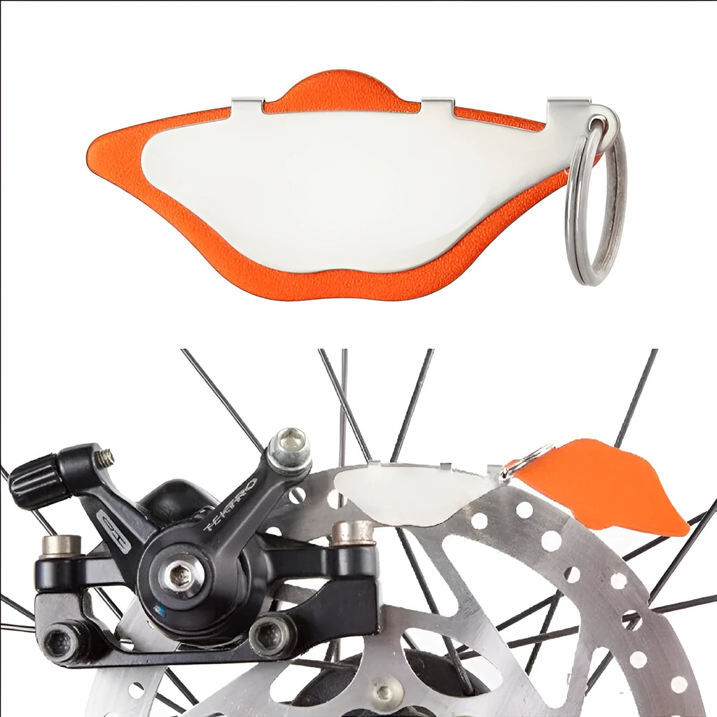 Black and orange mountain bike disc brake pads with a scratch-proof design.