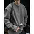Solid colour loose fit pullover top with long sleeves in grey, black or apricot