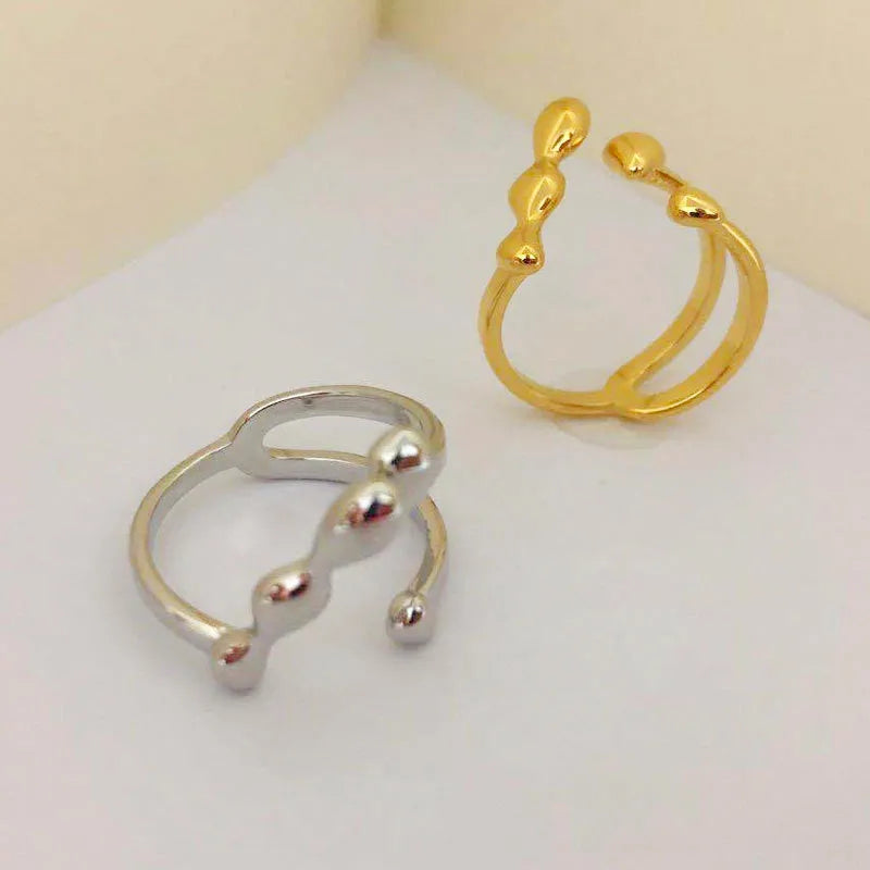 Brass women's fashion ring with spherical design in gold or silver colour