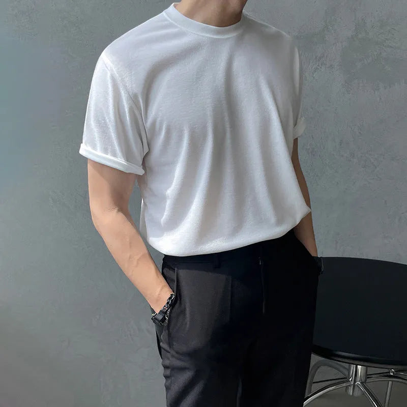 Slim fit men's cotton T-shirt in black on a white background, showing round neck and short sleeves.