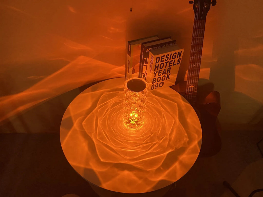Modern acrylic rose LED table lamp with diamond base and touch control on wooden surface