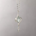 Hollow out Mori style winding pendant on an adjustable alloy cross chain necklace.