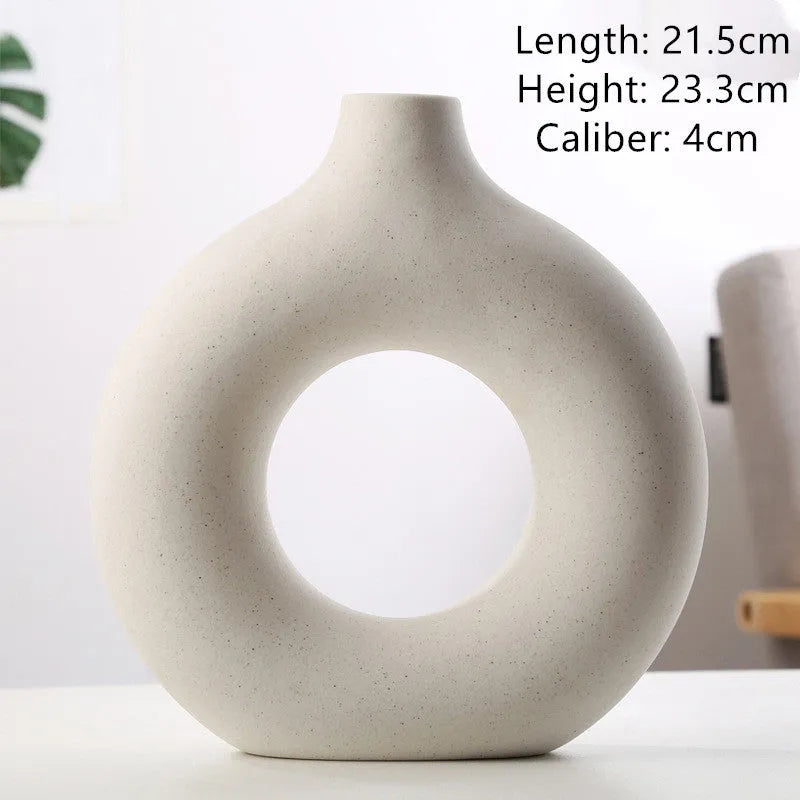 Unglazed porcelain biscuit vase with frosted particle surface in neutral colour