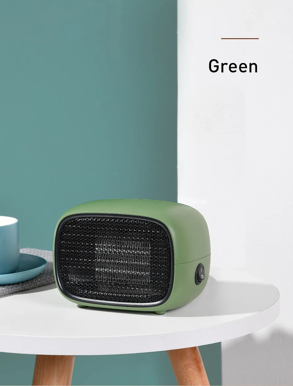 Mini ABS plastic PTC ceramic heater in green colour showing compact dimensions