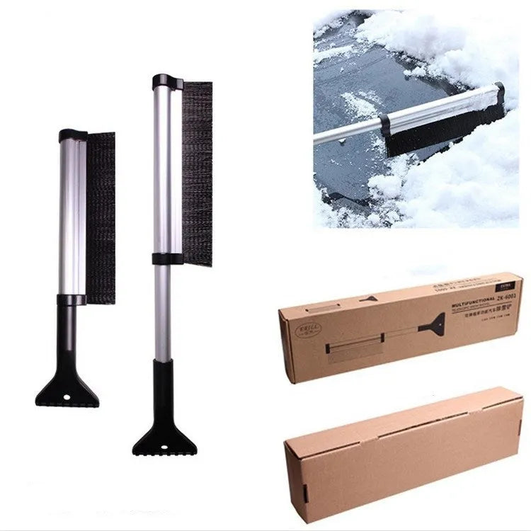 Silver retractable aluminum alloy car snow shovel extended to 65cm on a vehicle windscreen