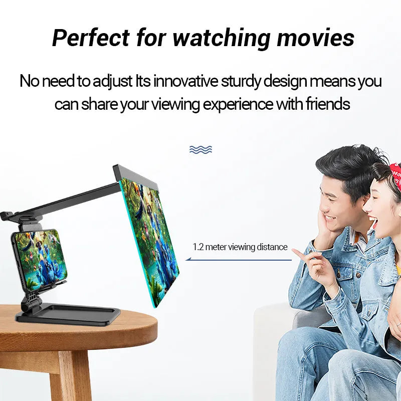 Black foldable mobile phone screen amplifier with detachable holder on a desk