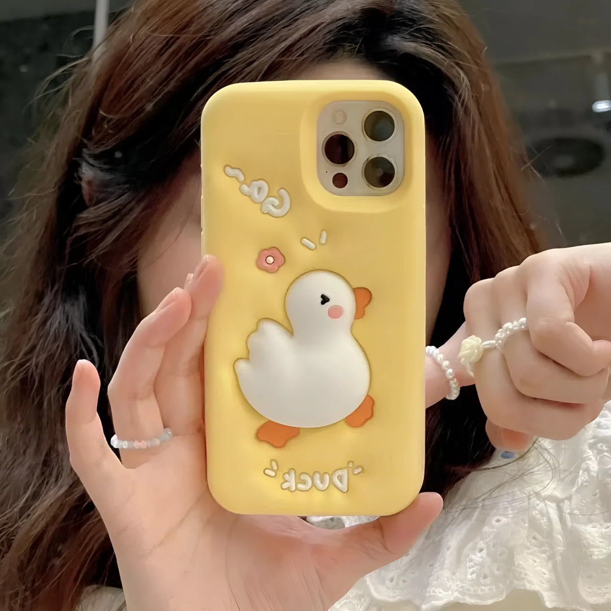 Yellow silicone phone case with three-dimensional cartoon duck for iPhone, featuring press pinch decompression element
