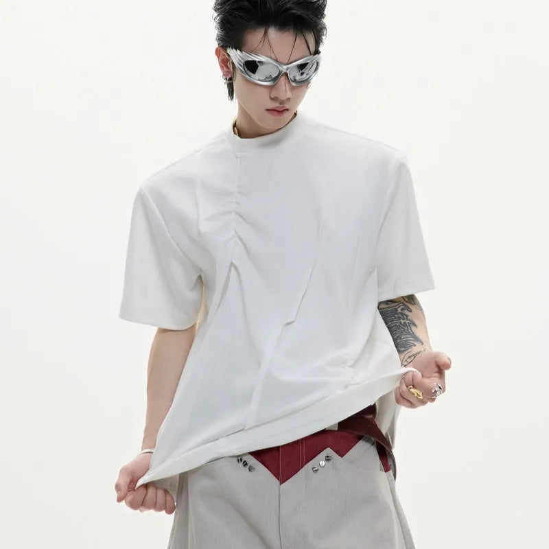Men's loose grey cotton T-shirt with round neck and asymmetric stitching on the front.
