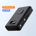 Black and white wireless charging power bank with phone bracket showing 20000mAh capacity and display screen