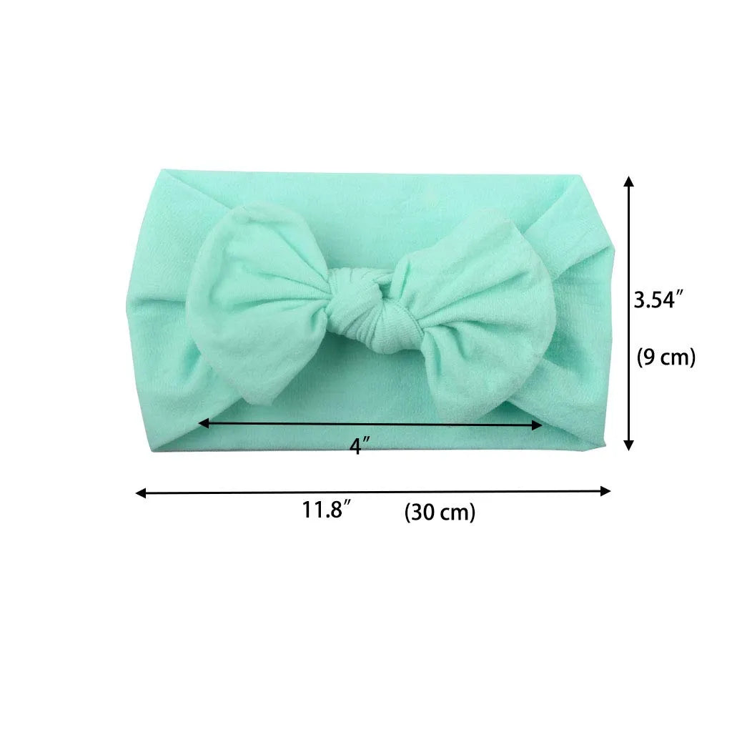 Super stretchy soft knot headband with hair bow for baby girls in one of 22 colours
