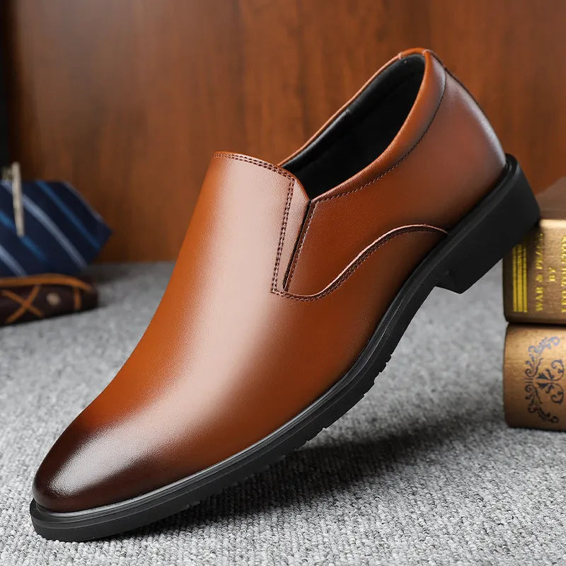 Men's black leather slip-on loafers with a rubber sole and leather toe cap on a white background.