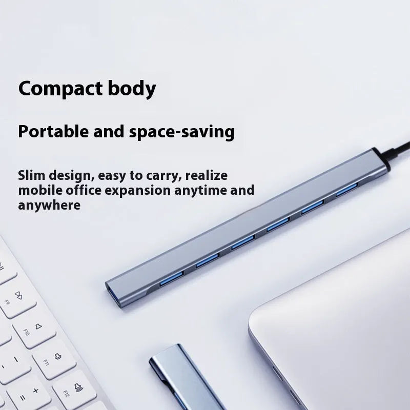 Blue USB-C 7-in-1 docking station with seven USB ports and 0.1m cable on a desk