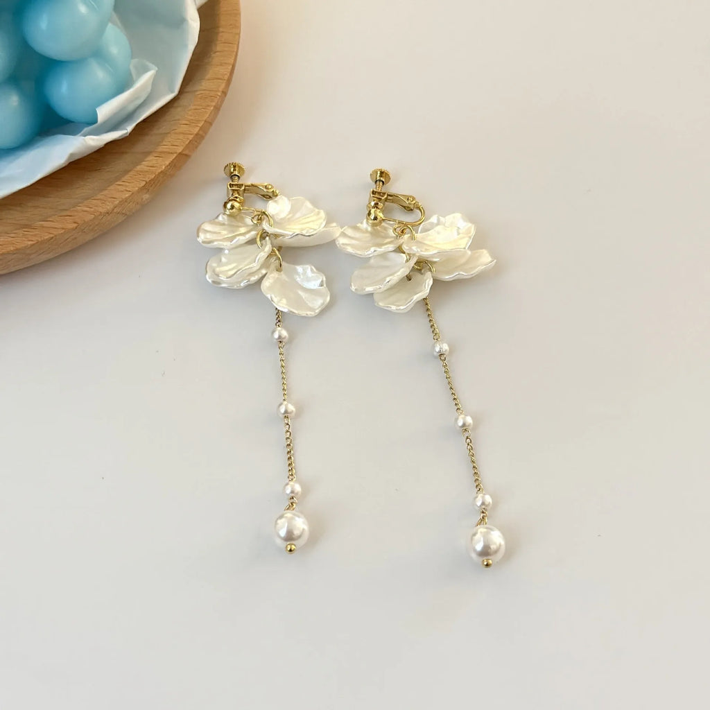 Women's acrylic shell pearl tassel clip earrings with four clip options showing 8.8cm length