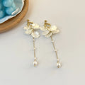 Women's acrylic shell pearl tassel clip earrings with four clip options showing 8.8cm length