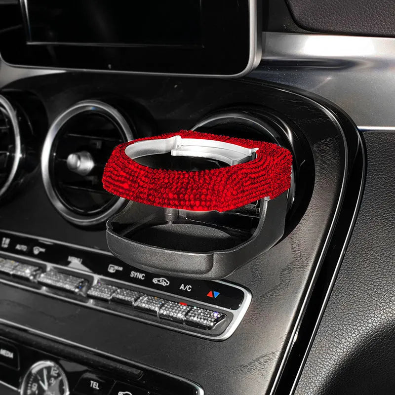 White diamond encrusted ABS plastic car cup holder mounted on a vehicle air vent.