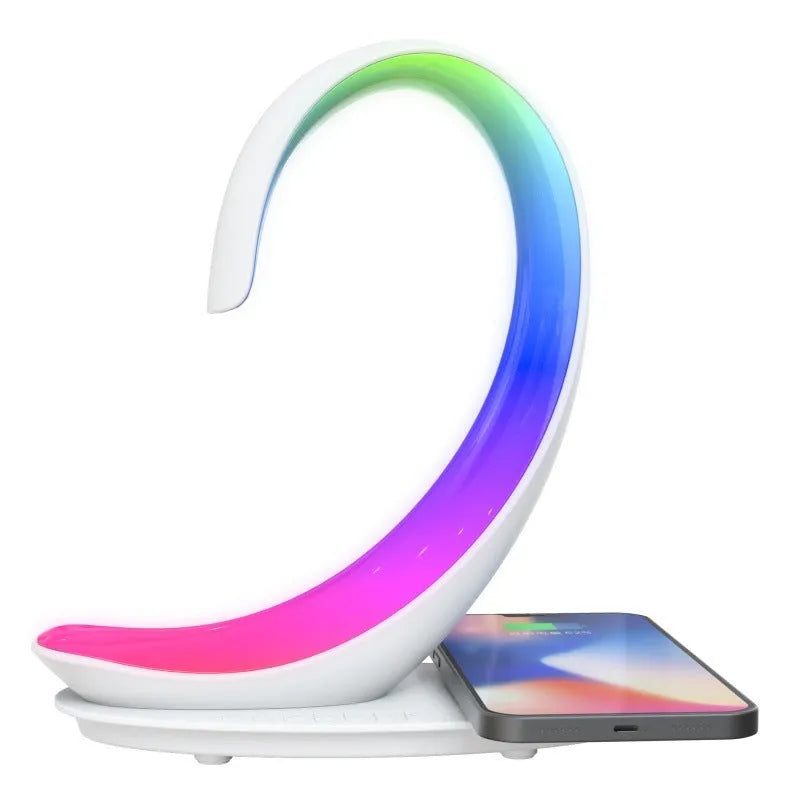 Multi-functional white swan desktop light with wireless charger, Bluetooth speaker, and colourful atmosphere light on a desk