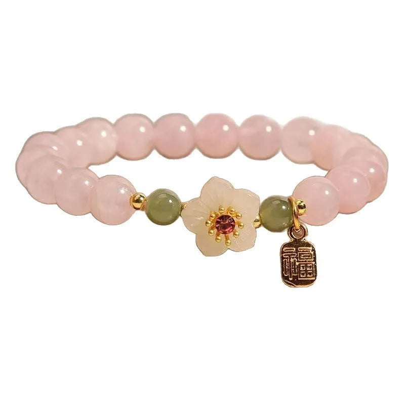 Crystal Hetian jade beaded bracelet with peach blossom design and camellia fruit elements