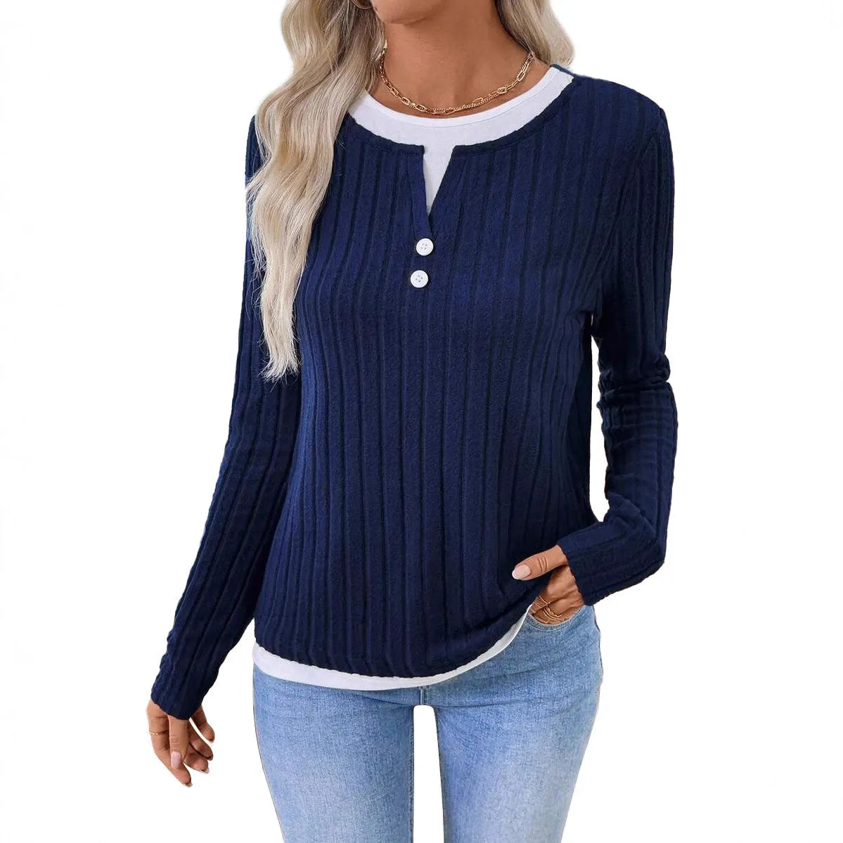 Women's black two-piece style pullover sweater with round neck and button detail on long sleeves.