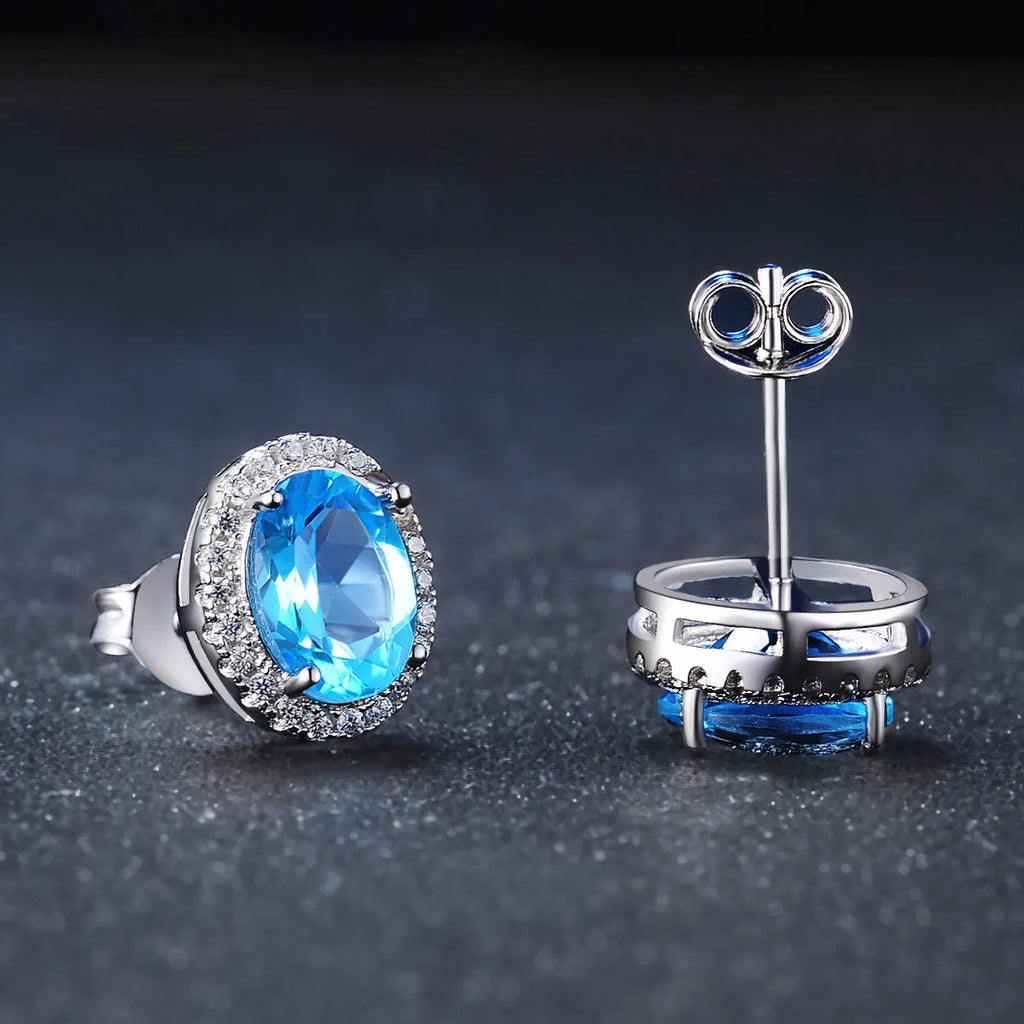 925 Sterling Silver four-piece jewellery set with Blue Topaz gemstones including earrings, ring, pendant and necklace