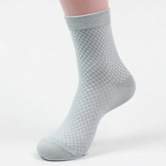 Men's bamboo fibre socks in a small square pattern, shown in navy blue colour.