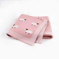 Soft pink baby blanket cover for a sheepskin, laid flat showing its rectangular 100cm by 80cm size.
