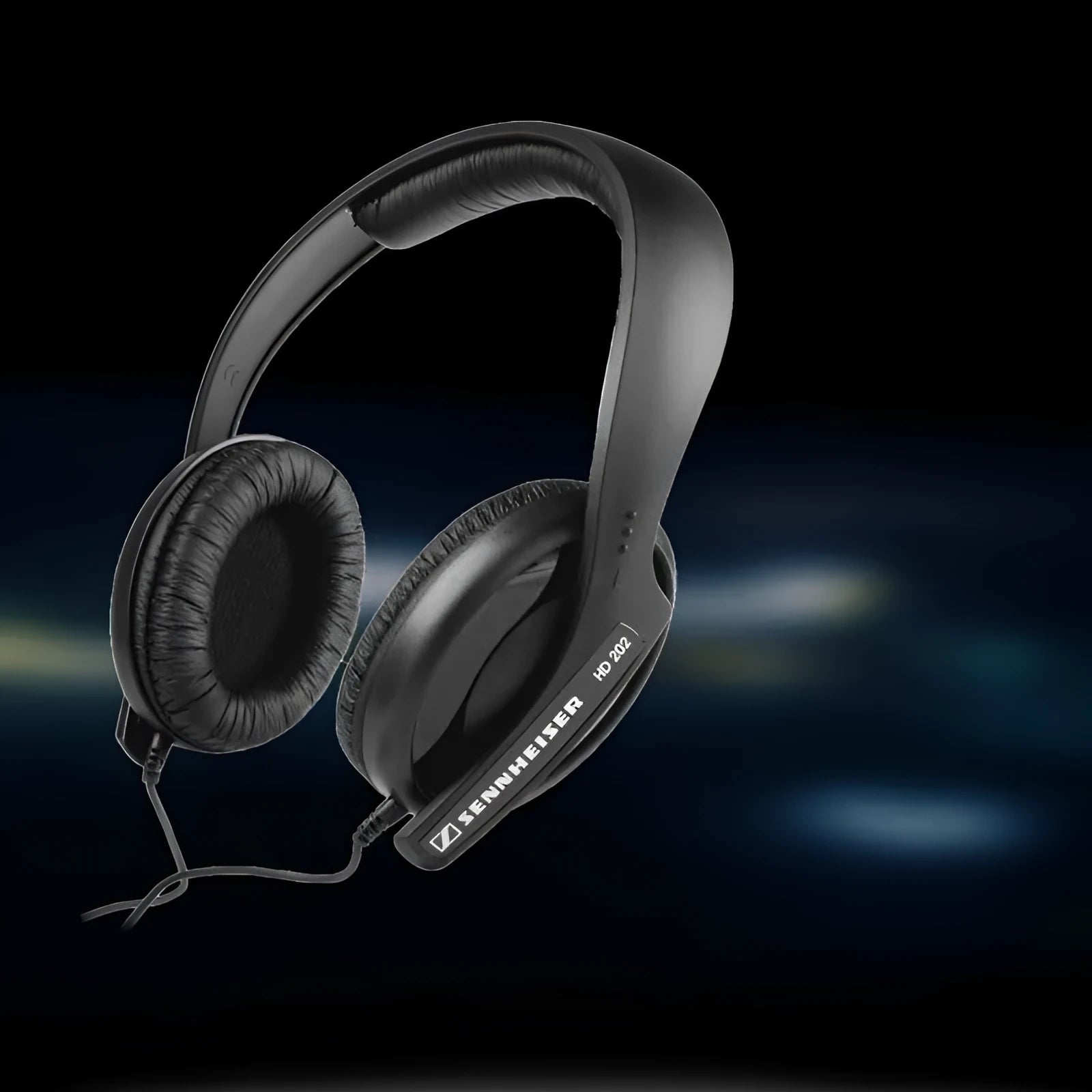 Black wired head-mounted monitor headphones with 40mm driver and 2.5m cable on a desk
