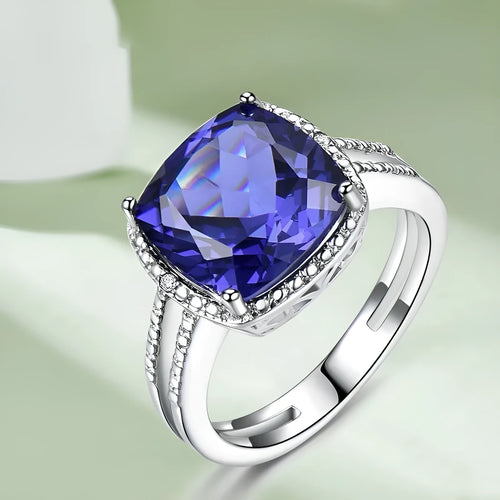 A blue tanzanite stone set in a sterling silver women's ring, showing front detail.