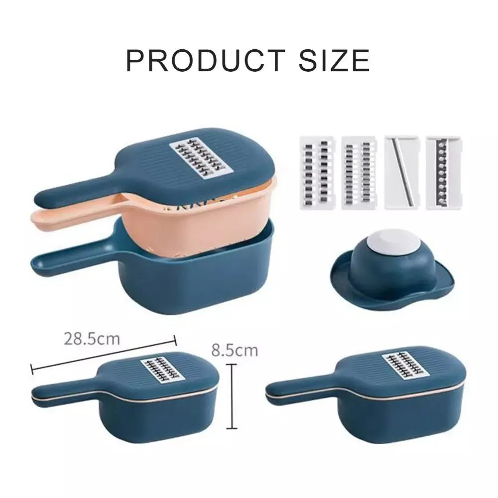 Dark blue vegetable cutter with four stainless steel blades, a drain basket, and a hand guard on a kitchen counter.