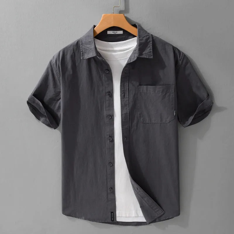 Men's loose-fit pure cotton short sleeve shirt in light blue, showing casual cardigan style.
