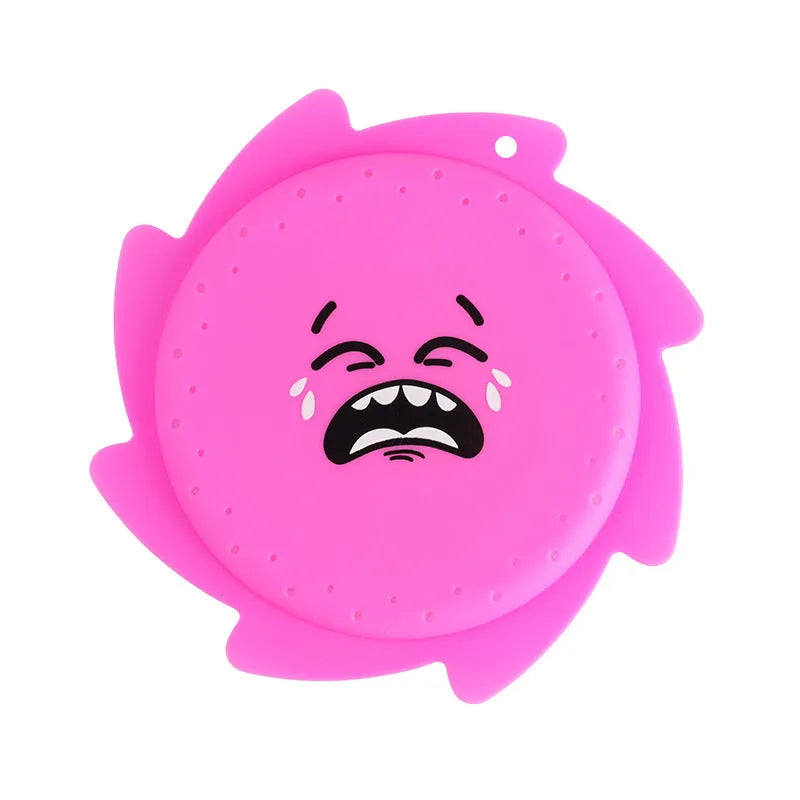 Silicone water toy in blue expression style on a wet surface for bath play