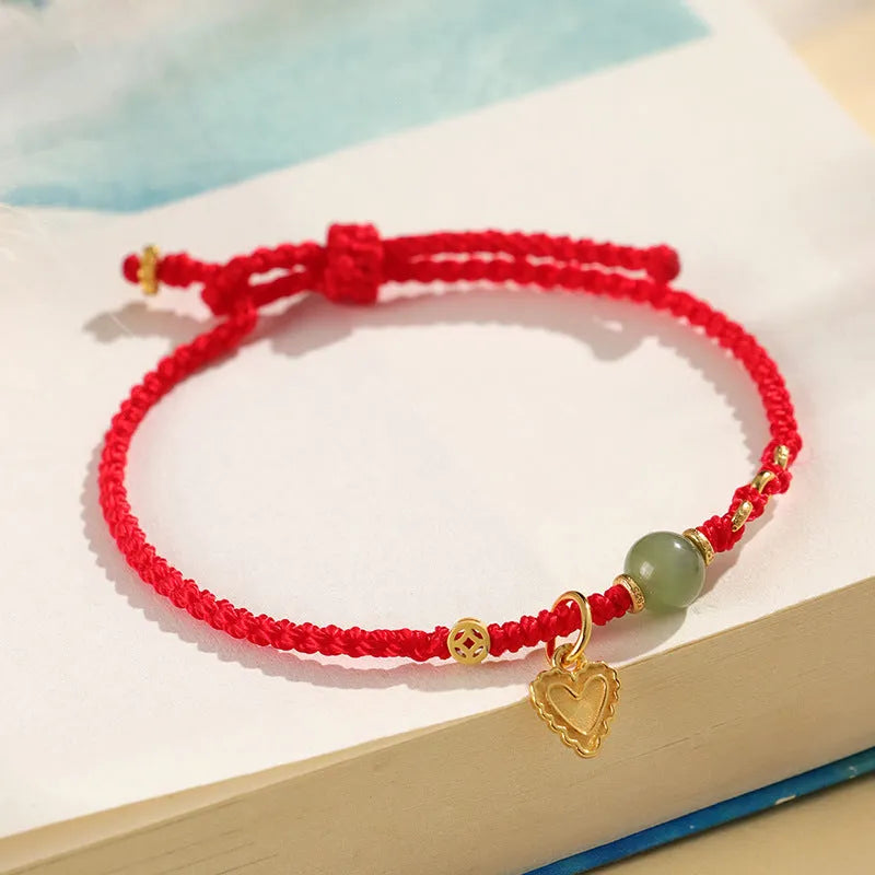Handmade women's bracelet woven from 925 silver and red Hetian jade with carrying strap.