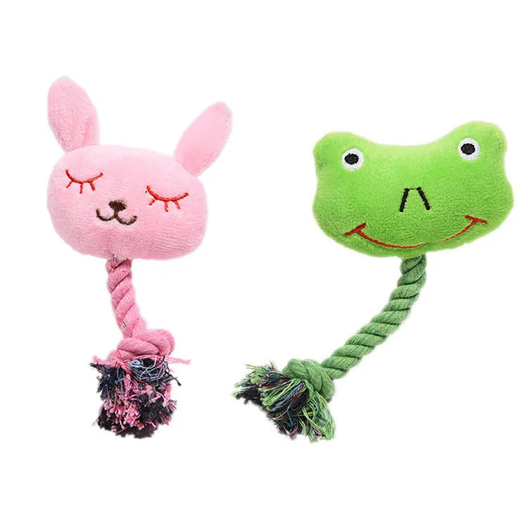 Pink rabbit-shaped plush squeaky dog toy with bite-resistant fabric placed on a light background