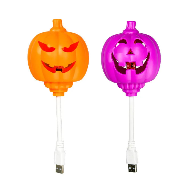 Plastic pumpkin-shaped lamp glowing with either purple or yellow light, measuring 22cm tall.